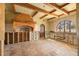 Kitchen featuring tile floors, exposed beams, an arched window, and a brick oven hood at 11320 E 6Th E St, Treasure Island, FL 33706