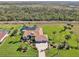 Overhead view of the expansive grounds with a large lot, pool and landscaping at 1145 Boundary Blvd, Rotonda West, FL 33947