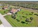 Aerial view of the single-Gathering home with its own pool at 1145 Boundary Blvd, Rotonda West, FL 33947
