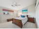 Bedroom with neutral carpet, a queen size bed and an ensuite bathroom at 1145 Boundary Blvd, Rotonda West, FL 33947