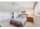 Bright bedroom with a queen bed, carpeted floors, and ensuite access at 1145 Boundary Blvd, Rotonda West, FL 33947