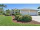 Beautiful single-Gathering home featuring a manicured lawn and a spacious two-car garage at 1145 Boundary Blvd, Rotonda West, FL 33947