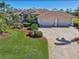 Well maintained home with a three car garage and lush landscaping at 1145 Boundary Blvd, Rotonda West, FL 33947