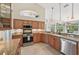 Spacious kitchen with stainless steel appliances, granite countertops, and ample cabinet space at 1145 Boundary Blvd, Rotonda West, FL 33947