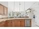 Kitchen bar with granite countertops, stainless steel appliances, and a view to the lanai at 1145 Boundary Blvd, Rotonda West, FL 33947