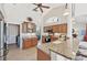 Kitchen with granite countertops, stainless steel appliances, and a view into the living area at 1145 Boundary Blvd, Rotonda West, FL 33947