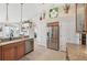 Kitchen featuring stainless steel appliances, granite countertops, and access to additional storage at 1145 Boundary Blvd, Rotonda West, FL 33947