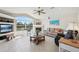 Comfortable living room with fireplace, large windows, and stylish furnishings at 1145 Boundary Blvd, Rotonda West, FL 33947