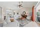 Spacious living room featuring neutral-toned furniture, tile floors, and abundant natural light at 1145 Boundary Blvd, Rotonda West, FL 33947