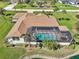 An overhead view of the pool and lanai, bordered by lush landscaping at 1145 Boundary Blvd, Rotonda West, FL 33947