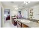 Bathroom boasts granite countertops, dual sinks, and a view into the connected bedroom at 12857 Satin Lily Dr, Riverview, FL 33579