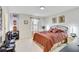 Warm bedroom with neutral tones, decorative wall hangings, and comfortable bed at 12857 Satin Lily Dr, Riverview, FL 33579