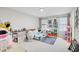 Bright bedroom with a playful hopscotch rug and plenty of space for toys and creativity at 12857 Satin Lily Dr, Riverview, FL 33579
