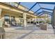 Spacious covered patio with outdoor seating and ample room for entertaining at 12857 Satin Lily Dr, Riverview, FL 33579