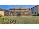 The screened-in lanai spans the rear of the home, seamlessly connecting indoor and outdoor living spaces at 12857 Satin Lily Dr, Riverview, FL 33579