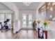 Bright foyer with hardwood floors, elegant decor, and a welcoming atmosphere upon entry at 12857 Satin Lily Dr, Riverview, FL 33579