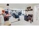 Spacious home theater with a large screen, comfortable seating, and a projector for immersive entertainment at 12857 Satin Lily Dr, Riverview, FL 33579