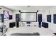 Large home theater screen and sound system provides immersive cinematic experience at 12857 Satin Lily Dr, Riverview, FL 33579