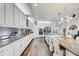 Spacious kitchen featuring white cabinets, stainless steel appliances, and a large island at 12857 Satin Lily Dr, Riverview, FL 33579