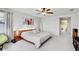 Comfortable bedroom with a ceiling fan, a large bed, and contemporary décor at 12857 Satin Lily Dr, Riverview, FL 33579