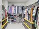 Organized walk-in closet with wire shelving and ample storage for clothing and accessories at 12857 Satin Lily Dr, Riverview, FL 33579