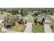 Aerial view of homes with green roofs in a well-maintained community surrounded by trees at 13247 Palmilla Cir, Dade City, FL 33525