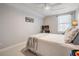 Comfortable bedroom offers plush carpeting, natural light, and a ceiling fan for added air circulation at 13247 Palmilla Cir, Dade City, FL 33525