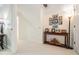 Hallway with carpet, decorative table and photographs at 13247 Palmilla Cir, Dade City, FL 33525