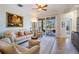 Cozy and bright living room with comfortable seating and a sliding door to the outside at 13247 Palmilla Cir, Dade City, FL 33525