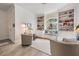 Bright sitting room featuring a window seat and built-in bookcases with many decorative objects at 13247 Palmilla Cir, Dade City, FL 33525