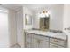 Updated bathroom with granite countertops, sleek fixtures, and a built-in vanity at 1375 Doolittle Ln # 103, Dunedin, FL 34698