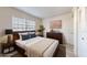 Main bedroom with wood floors, large window, and closet space at 1375 Doolittle Ln # 103, Dunedin, FL 34698