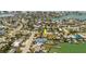 An aerial view of a property in a waterfront community, with a pool and dock access at 14031 E Parsley Dr, Madeira Beach, FL 33708