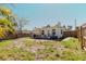 Backyard featuring outdoor seating, a grill, and a wooden fence at 14031 E Parsley Dr, Madeira Beach, FL 33708