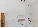 Bathroom with a new subway-tiled shower and black fixtures at 14031 E Parsley Dr, Madeira Beach, FL 33708
