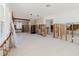 Bright living room with exposed studs, white trim, and potential for customization at 14031 E Parsley Dr, Madeira Beach, FL 33708