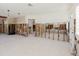 Spacious living room with exposed studs and white floors at 14031 E Parsley Dr, Madeira Beach, FL 33708