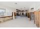 Open living room with exposed studs and wood beams at 14031 E Parsley Dr, Madeira Beach, FL 33708