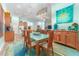 Open floor plan with dining area, kitchen and living room; the interior offers natural light and stylish decor at 14315 Rolling Dune Rd, Lithia, FL 33547