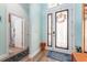 Inviting entryway featuring tile floors, a decorative door, and access to a bathroom at 14315 Rolling Dune Rd, Lithia, FL 33547