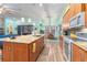Open kitchen featuring a large island, stainless steel appliances, and granite countertops at 14315 Rolling Dune Rd, Lithia, FL 33547