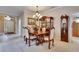 Charming dining room with a chandelier, wood table, and china cabinet at 144 Silver Falls, Apollo Beach, FL 33572