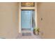 Inviting front entrance featuring a blue door, sidelight window, and a welcome mat at 144 Silver Falls, Apollo Beach, FL 33572