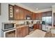 Beautiful kitchen with stainless steel appliances, granite countertops, custom cabinets, and ample counter space at 144 Silver Falls, Apollo Beach, FL 33572