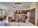 Gourmet kitchen featuring stainless steel appliances, granite countertops, and a breakfast bar with seating at 144 Silver Falls, Apollo Beach, FL 33572