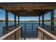 Scenic view from a wooden gazebo overlooking a peaceful lake and surrounding community at 144 Silver Falls, Apollo Beach, FL 33572