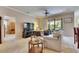 Cozy living room features a ceiling fan, sliding glass doors to the lanai, and neutral decor at 144 Silver Falls, Apollo Beach, FL 33572