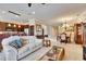 Spacious living room flowing into the kitchen and dining areas, perfect for entertaining at 144 Silver Falls, Apollo Beach, FL 33572