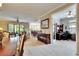 Open concept living area with view to the dining room, kitchen, and office space at 144 Silver Falls, Apollo Beach, FL 33572
