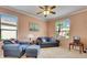 Comfortable living room with ceiling fan and an abundance of natural light at 144 Silver Falls, Apollo Beach, FL 33572